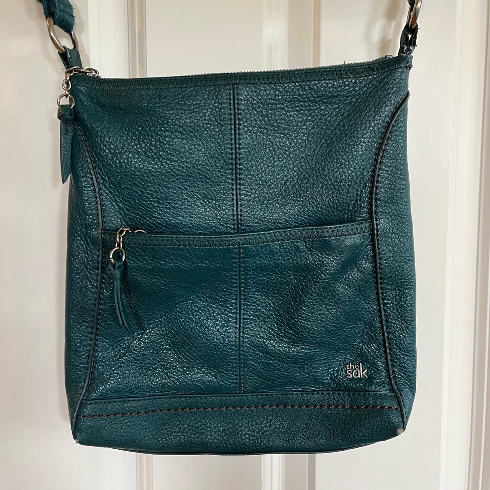 The Sak - turquoise leather cross-body bag.